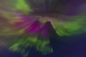 Atmospheric Mood Photos Prints: The converging rays of an aurora borealis overhead