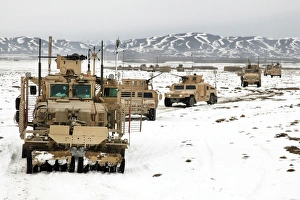 A convoy of vehicles during a route clearing procedure in Afghanistan A convoy of vehicles during a route clearing procedure in Afghanistan
