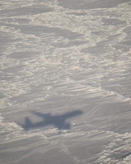 A DC-8 aircraft casts its shadow over the Bering Sea A DC-8 aircraft casts its shadow over the Bering Sea