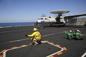 An E-2C Hawkeye launches from the flight deck of USS Dwight D. Eisenhower An E-2C Hawkeye launches from the flight deck of USS Dwight D. Eisenhower