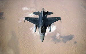 An Emirati F-16 disconnects from a KC-10A Extender after refueling during a multinational An Emirati F-16 disconnects from a KC-10A Extender after refueling during a multinational
