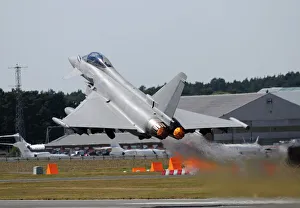 Eurofighter EF2000 Typhoon from the Royal Air Force at full afterburner during takeoff Eurofighter EF2000 Typhoon from the Royal Air Force at full afterburner during takeoff