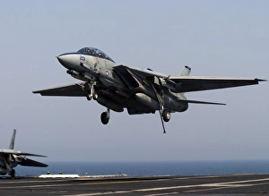 An F-14D Tomcat comes in for an arrested landing on the flight deck of USS Theodore An F-14D Tomcat comes in for an arrested landing on the flight deck of USS Theodore