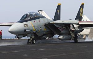 An F-14D Tomcat launches off the flight deck of USS Theodore Roosevelt An F-14D Tomcat launches off the flight deck of USS Theodore Roosevelt