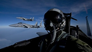 Three F-15 Eagles fly high during a training mission Three F-15 Eagles fly high during a training mission