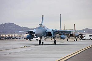 F-15C Eagles taxi to the runway at Nellis Air Force Base, Nevada F-15C Eagles taxi to the runway at Nellis Air Force Base, Nevada