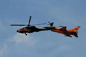 An F-16 Falcon and AH-64 Apache from the Royal Netherlands Air Force An F-16 Falcon and AH-64 Apache from the Royal Netherlands Air Force