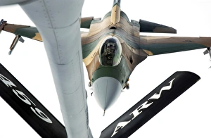 An F-16 Fighting Falcon approaches the boom on of a KC-135 Stratotanker An F-16 Fighting Falcon approaches the boom on of a KC-135 Stratotanker