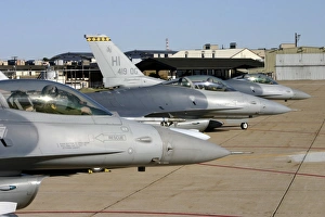 Three F-16 Fighting Falcons prepare to taxi for departure Three F-16 Fighting Falcons prepare to taxi for departure