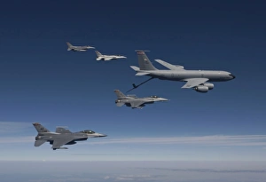 Four F-16s and a KC-135 fly in formation over Arizona Four F-16s and a KC-135 fly in formation over Arizona