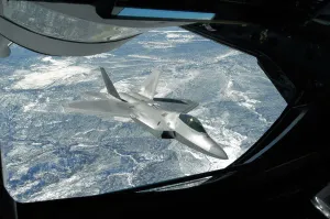 An F-22 Raptor banks away from a KC-135 Statotanker during a refueling operation An F-22 Raptor banks away from a KC-135 Statotanker during a refueling operation