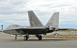 An F-22 Raptor taxis the runway on Elmendorf Air Force Base, Alaska An F-22 Raptor taxis the runway on Elmendorf Air Force Base, Alaska