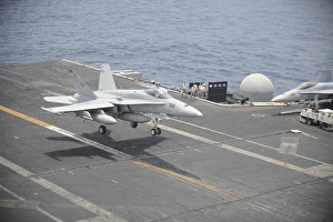 An F/A-18C Hornet lands on the flight deck of USS Nimitz An F/A-18C Hornet lands on the flight deck of USS Nimitz