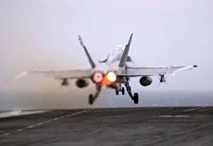 An F/A-18C Hornet launches from the flight deck aboard USS Theodore Roosevelt An F/A-18C Hornet launches from the flight deck aboard USS Theodore Roosevelt