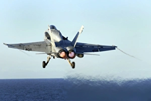 An F/A-18C Hornet launches from the flight deck of USS John C. Stennis An F/A-18C Hornet launches from the flight deck of USS John C. Stennis