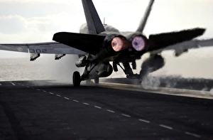 An F/A-18C Hornet rockets down the flight deck of USS Ronald Reagan An F/A-18C Hornet rockets down the flight deck of USS Ronald Reagan