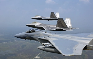 Three F/A-22 Raptors fly in formation during a training sortie Three F/A-22 Raptors fly in formation during a training sortie