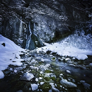 Gegskiy waterfall in the snowy mountains of Ritsa Nature Reserve Gegskiy waterfall in the snowy mountains of Ritsa Nature Reserve