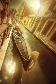 Gondola in Venetian canal at sunset, Venice, Italy Gondola in Venetian canal at sunset, Venice, Italy