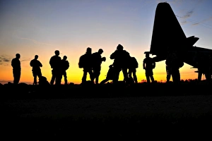 Green Berets prepare to board a KC-130 aircraft Green Berets prepare to board a KC-130 aircraft