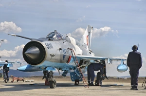 Ground crew conducts maintenance on a Romanian Air Force MiG-21C Ground crew conducts maintenance on a Romanian Air Force MiG-21C