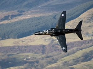 A Hawk T1 trainer aircraft of the Royal Air Force low flying over North Wales A Hawk T1 trainer aircraft of the Royal Air Force low flying over North Wales