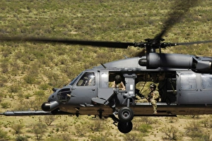 An HH-60 Pave Hawk flies over the desert during Angel Thunder 2010 An HH-60 Pave Hawk flies over the desert during Angel Thunder 2010