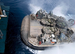 A landing craft air cushion enters teh well deck of USS Iwo Jima A landing craft air cushion enters teh well deck of USS Iwo Jima