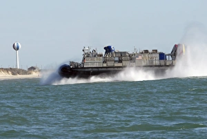 A landing craft air cushion prepares to land on the beach A landing craft air cushion prepares to land on the beach