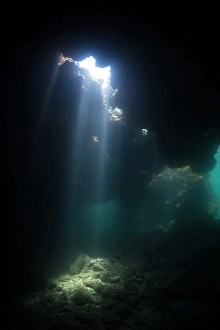 Central America Nature Images Prints: Light beams inside Dolphin's Den cavern