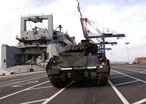 A M1A1 Abrams main battle tank is prepared for onload to the USNS Watson A M1A1 Abrams main battle tank is prepared for onload to the USNS Watson