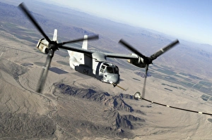 A Marine Corps MV-22 Osprey prepares to refuel midflight A Marine Corps MV-22 Osprey prepares to refuel midflight