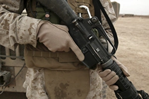 A Marine displays the required hand personal protective equipment A Marine displays the required hand personal protective equipment
