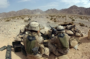 A marine fires his M2 .50 caliber heavy machine gun A marine fires his M2 .50 caliber heavy machine gun