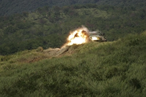 A Marine scores a direct hit while firing an AT-4 at an armored personnel carrier A Marine scores a direct hit while firing an AT-4 at an armored personnel carrier