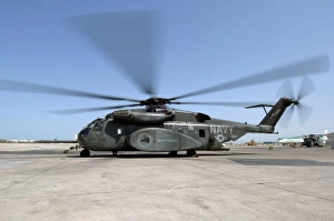 An MH-53E Sea Dragon helicopter sits ready on the flight line An MH-53E Sea Dragon helicopter sits ready on the flight line