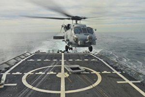 An MH-60R Sea Hawk helicopter lands aboard USS Halyburton An MH-60R Sea Hawk helicopter lands aboard USS Halyburton