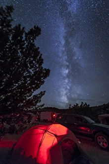The Milky Way sets behind a tent all aglow, Oklahoma The Milky Way sets behind a tent all aglow, Oklahoma