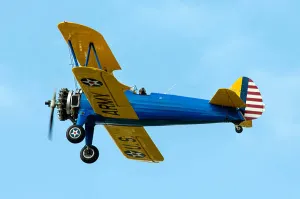 US Army Aviation History Prints: A Model 75 replica biplane in flight