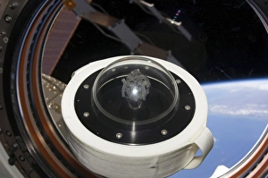 A moon rock floats aboard the International Space Station A moon rock floats aboard the International Space Station