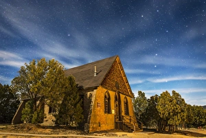 A moonlit nightscape of the historic Hearst Church in Pinos Altos, New Mexico A moonlit nightscape of the historic Hearst Church in Pinos Altos, New Mexico