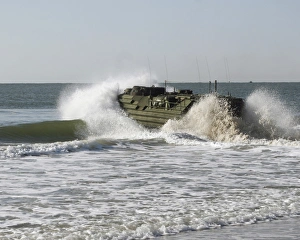 n amphibious assault vehicle splashes through the water n amphibious assault vehicle splashes through the water
