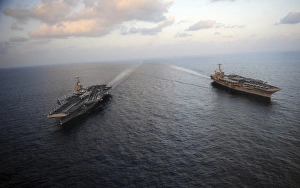 Nimitz-class aircraft carriers transit the Arabian Sea Nimitz-class aircraft carriers transit the Arabian Sea