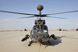 An OH-58D Kiowa helicopter prepares for liftoff from COB Speicher An OH-58D Kiowa helicopter prepares for liftoff from COB Speicher