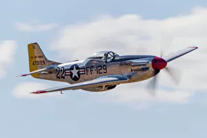A P-51 Mustang flies by at Vacaville, California A P-51 Mustang flies by at Vacaville, California