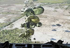 Pallets of relief supplies are air delivered from a C-17 Globemaster III over Haiti Pallets of relief supplies are air delivered from a C-17 Globemaster III over Haiti