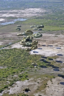 Pallets of relief supplies exit a C-17 Globemaster III cargo aircraft over Haiti Pallets of relief supplies exit a C-17 Globemaster III cargo aircraft over Haiti