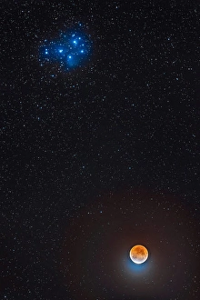 Partial Lunar Eclipse Prints: Partial eclipse of the moon below the Pleiades star cluster in Taurus
