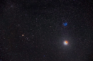 Partial Lunar Eclipse Prints: Partial eclipse of the moon below the Pleiades star cluster in Taurus