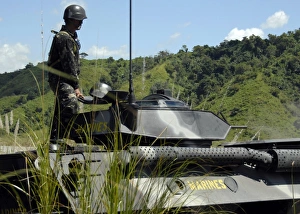 The Philippine Marine Battalion Landing Team fire the weapons systems of a light The Philippine Marine Battalion Landing Team fire the weapons systems of a light